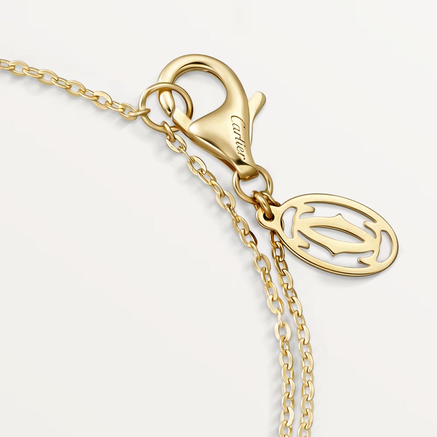Cartier,Trinity bracelet, on chain,Yellow gold chain with mixed trinity ring